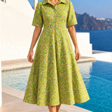 Full-length front view of a model wearing a light green Jaipur floral print pure cotton frock-style kurti midi dress.