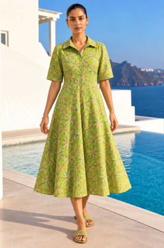 Full-length front view of a model wearing a light green Jaipur floral print pure cotton frock-style kurti midi dress.