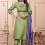 Side view of a model showcasing the straight silhouette, side slits, and comfortable trouser fit of a light green embroidered cotton kurta set paired with a draped patterned dupatta