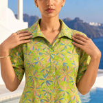 Upper body shot showcasing the collar neckline and floral print of a light green pure cotton frock-style kurti.