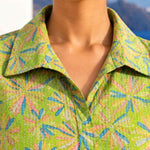Close-up view of collar neckline and Kantha-style threadwork on a light green pure cotton frock-style kurti for women.