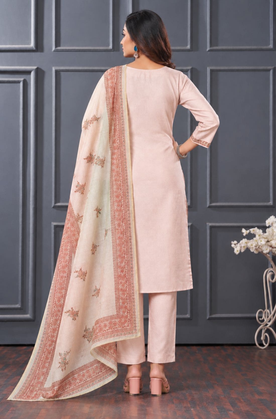 Back view of women’s light pink 3-piece silk blend kurta set with matching pants and printed dupatta.