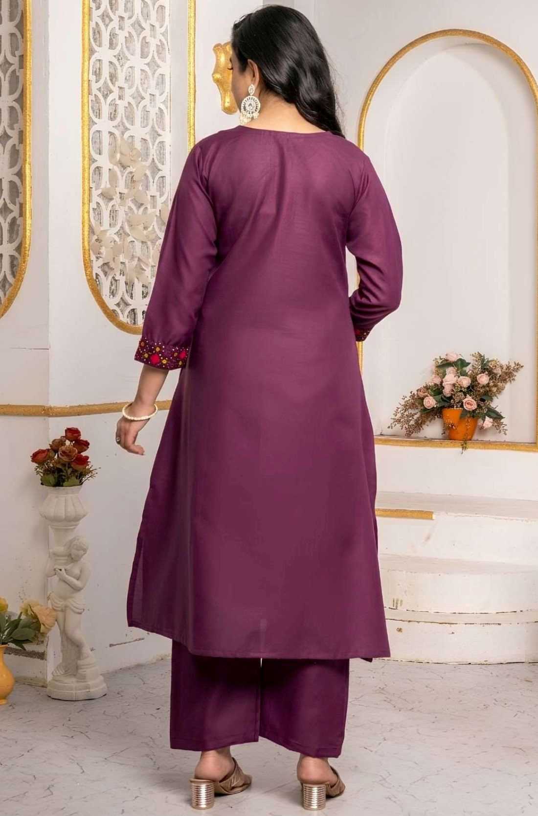 Back view of magenta pure cotton A-line kurta set with embroidered sleeve cuffs and matching straight pants.