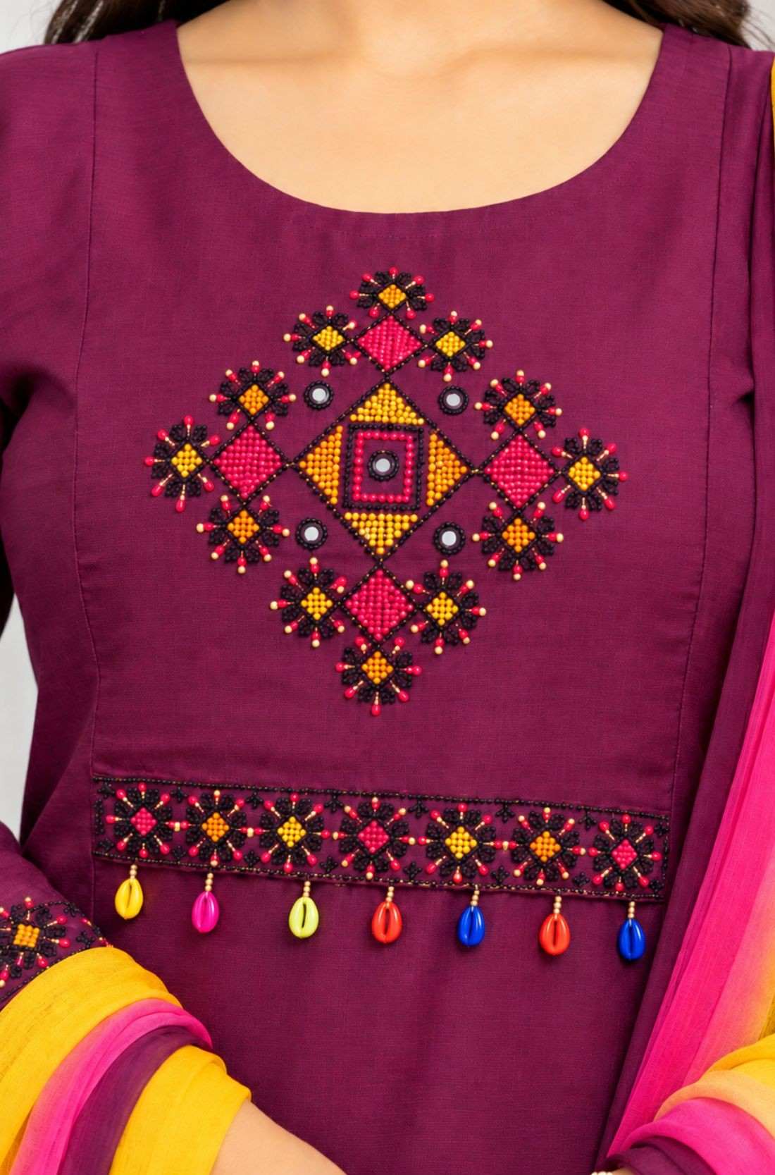Cross-stitch embroidery detail on magenta pure cotton kurta for women