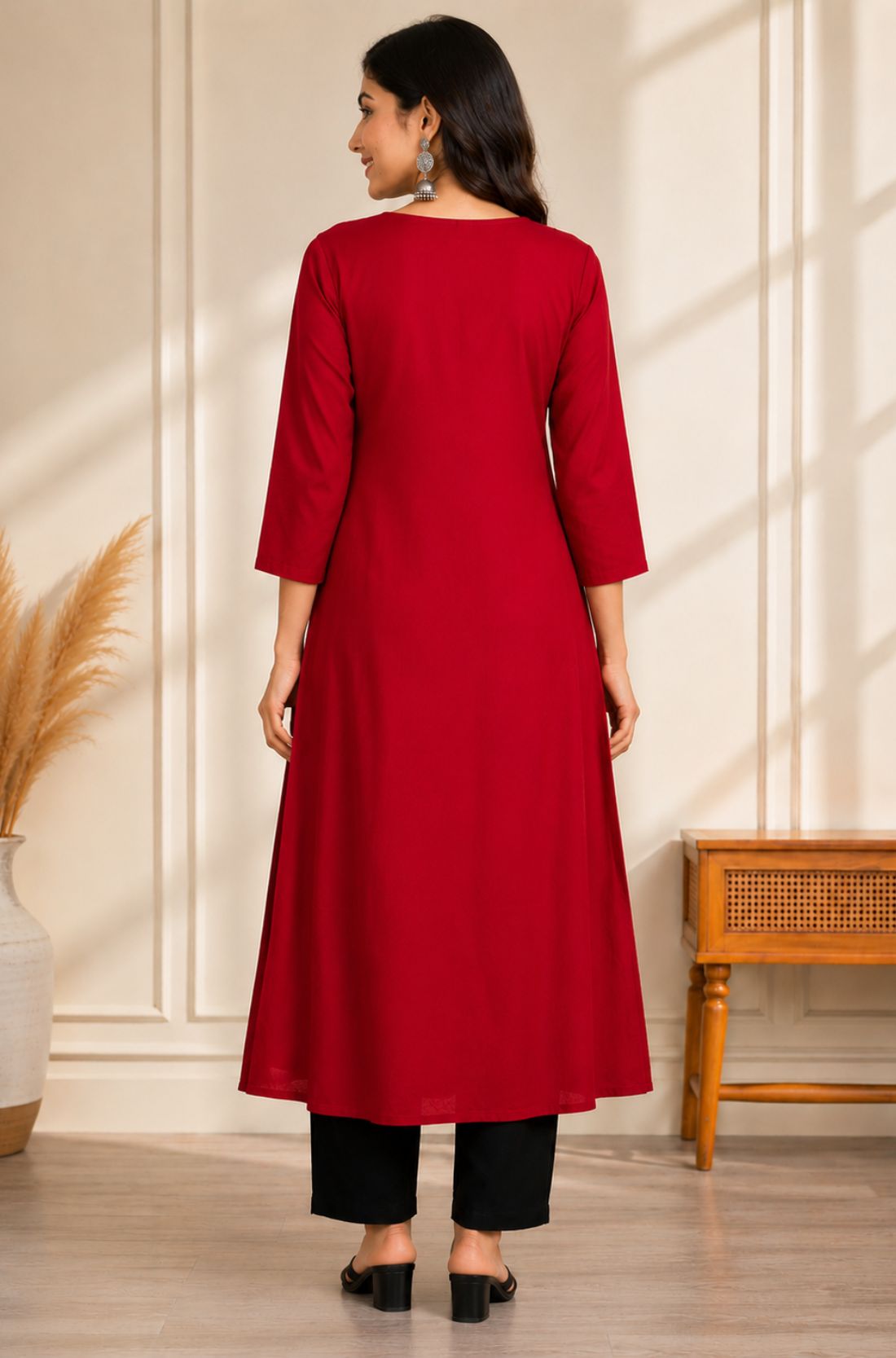 Back view of maroon A-line rayon kurta for women with 3/4 sleeves and flared hem
