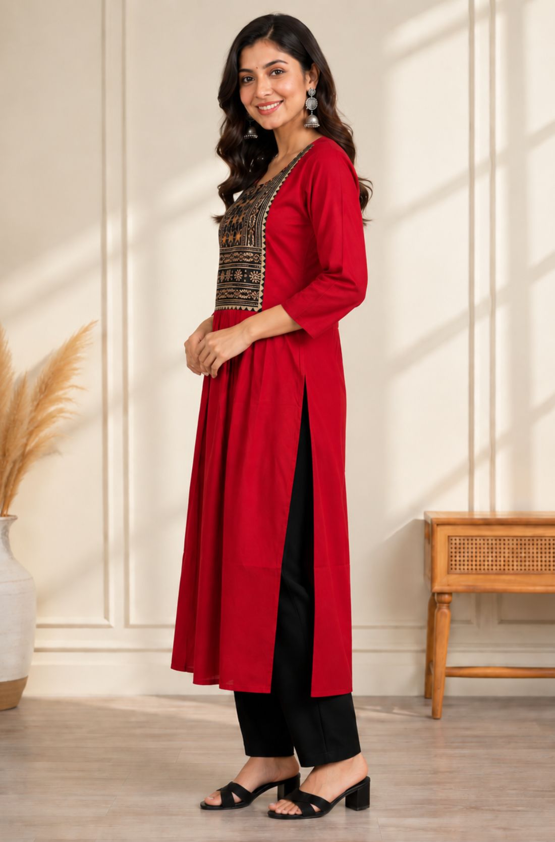 Side view of maroon A-line rayon kurta for women with hand embroidery and block print