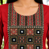 close-up of a maroon rayon kurta showcasing detailed mirror work and a traditional block-printed geometric yoke embroidery design.