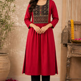 Woman wearing a maroon rayon A-line kurta with an embroidered yoke, shown in a full-length front view