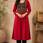 Woman wearing a maroon rayon A-line kurta with an embroidered yoke, shown in a full-length front view