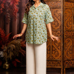 Close-up of mint green hand block print cotton short kurti showing floral pattern, wooden buttons, and front design details.