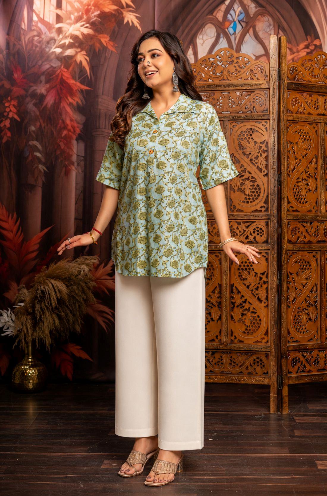 Close-up of mint green hand block print cotton short kurti showing floral pattern, wooden buttons, and front design details.