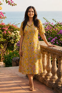 Ochre yellow printed cotton frock style kurti with Jaipur floral print, collar neck and flared hem, front view