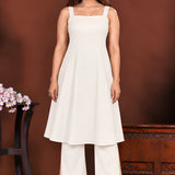 Off white sleeveless A-line inner, front view, included with the kurta set