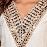 Close-up of mirror work V-neckline on an off-white Anarkali kurta set.
