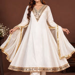 Woman wearing an off-white mirror work Anarkali kurta set with pants and dupatta