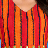 Macro shot of the V-neck and pleated yoke featuring contrast thread embroidery and mirror work accents on the orange handloom cotton midi dress for women.