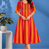Full front view of a woman wearing an orange handloom cotton pintuck embroidered midi dress with elbow sleeves and striped pattern.