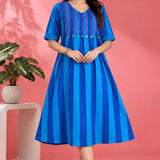 Full front view of a woman wearing a Philippine Blue handloom cotton pintuck embroidered midi dress with elbow sleeves and striped pattern.