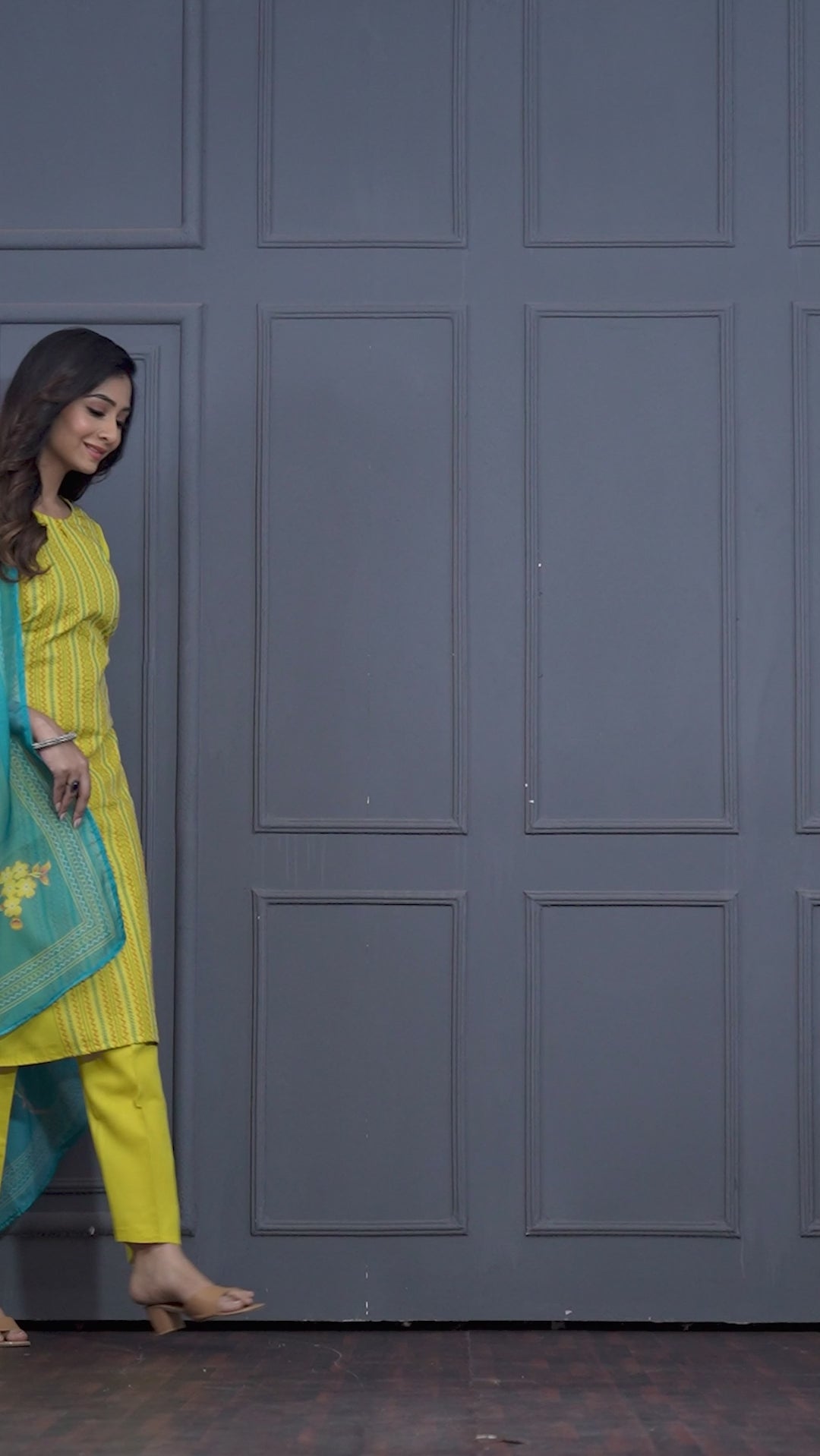 Women’s yellow cotton 3-piece kurta pant dupatta set featuring a straight-fit embroidered kurta, matching pants, and turquoise floral printed dupatta.