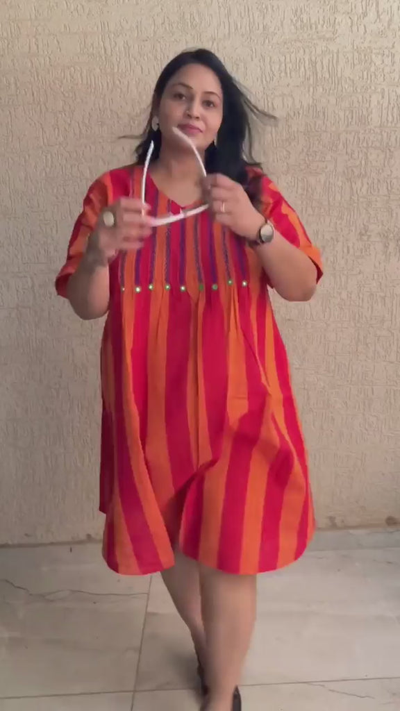 It is the Video of plus-size women who are wearing a pintuck embroidery dress 