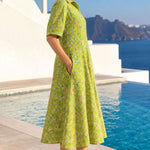 Side profile view of a light green pure cotton frock-style kurti highlighting the practical side pocket and A-line flare.