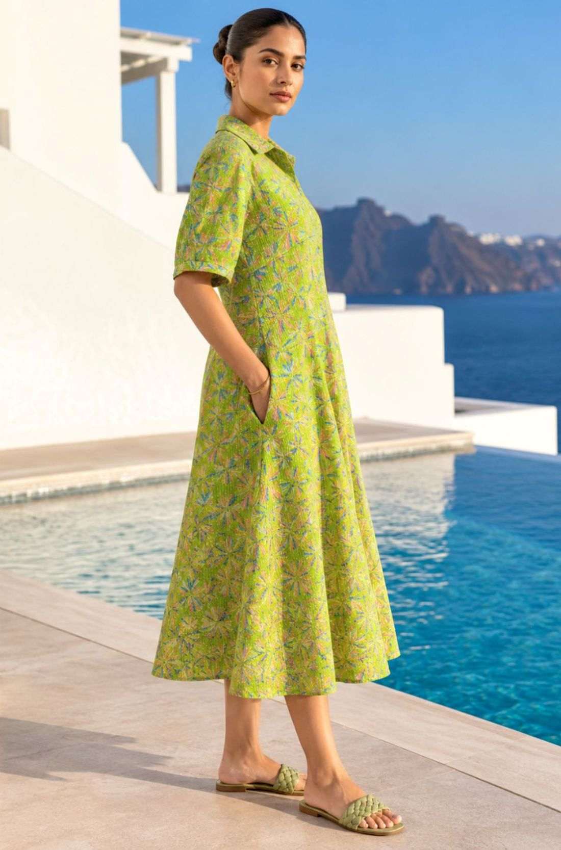 Side profile view of a light green pure cotton frock-style kurti highlighting the practical side pocket and A-line flare.