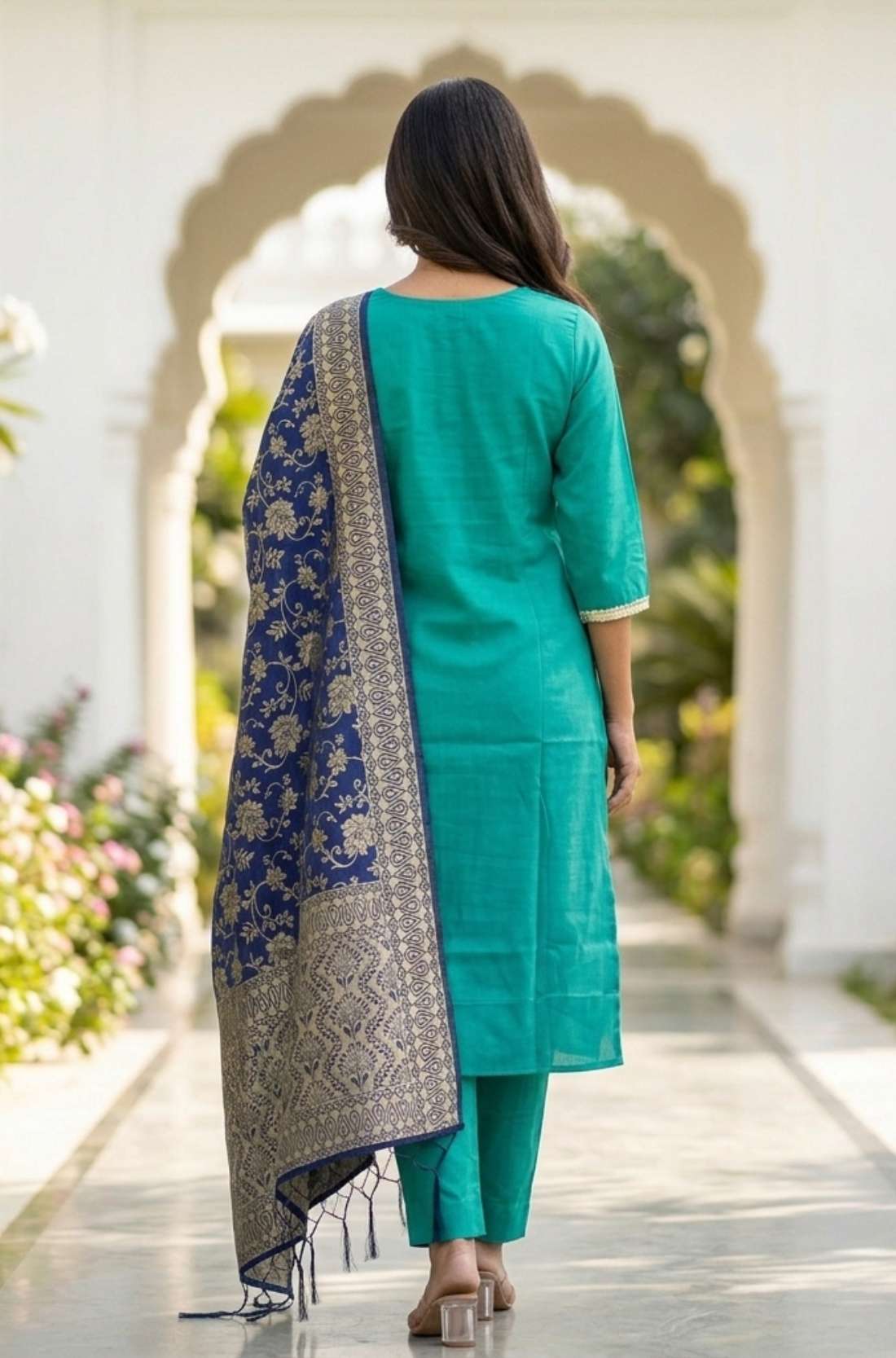 Rear view of the rama green embroidered straight-fit kurta set, showcasing the clean silhouette, straight trousers, and matching dupatta styling from behind.