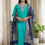 Front full length view of a model in a rama green embroidered kurta set with straight pants and a matching printed dupatta