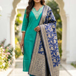 Front full-length view of a model in a premium rama green embroidered straight kurta set, featuring intricate white thread embroidery on the neckline yoke, paired with matching pants and a printed dupatta.