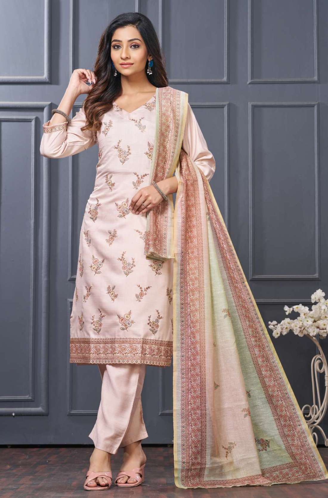 Front full length view of a model in a premium pink and green scalloped embroidered silk 3 piece kurta set showcasing elegant gold thread embroidery on the neckline, paired with straight pants and a matching dupatta.