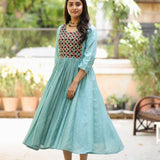 Sea green flared kurti showing A-line silhouette, gathered waist and flared hem