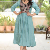 Sea green aari embroidery flared kurti with 3/4 sleeves and contrast black yoke, front view