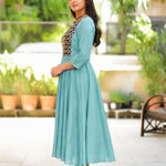 Side view of sea green A-line flared kurti with 3/4 sleeves and calf-length design