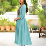 Side view of sea green A-line flared kurti with 3/4 sleeves and calf-length design