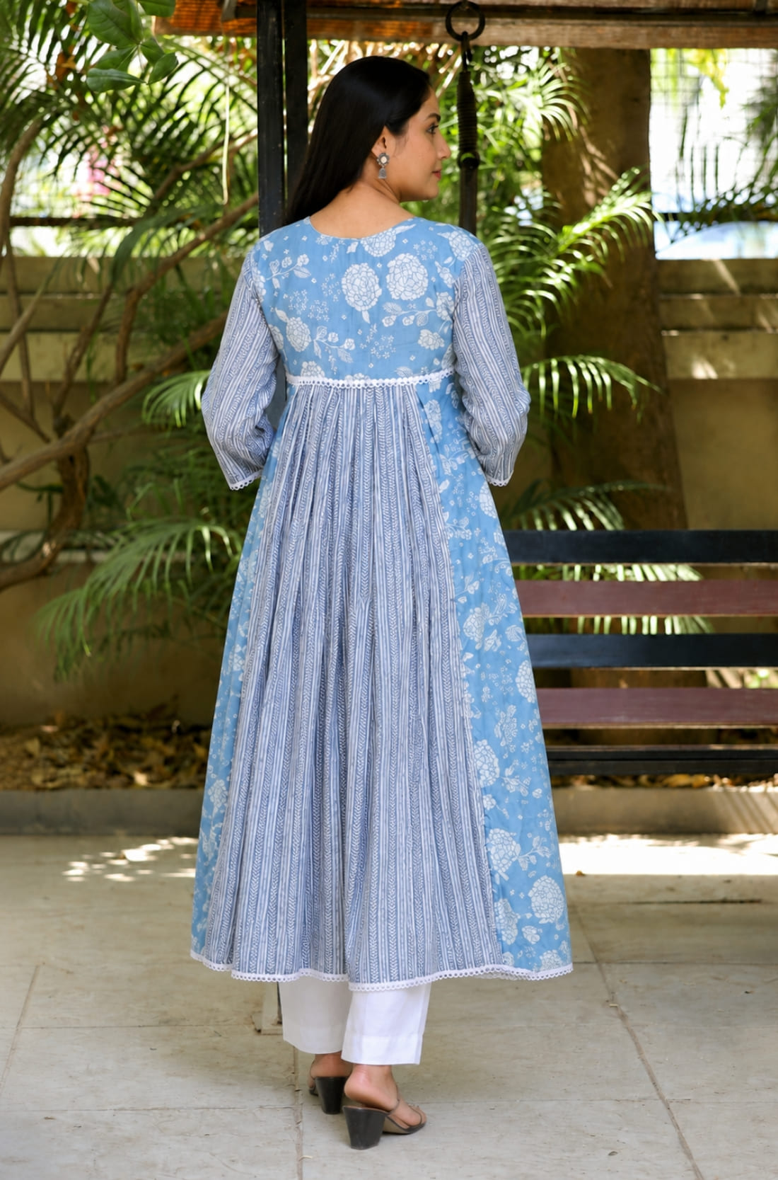 Back view of sky blue white muslin flared kurti with 3/4 sleeves and flared hem