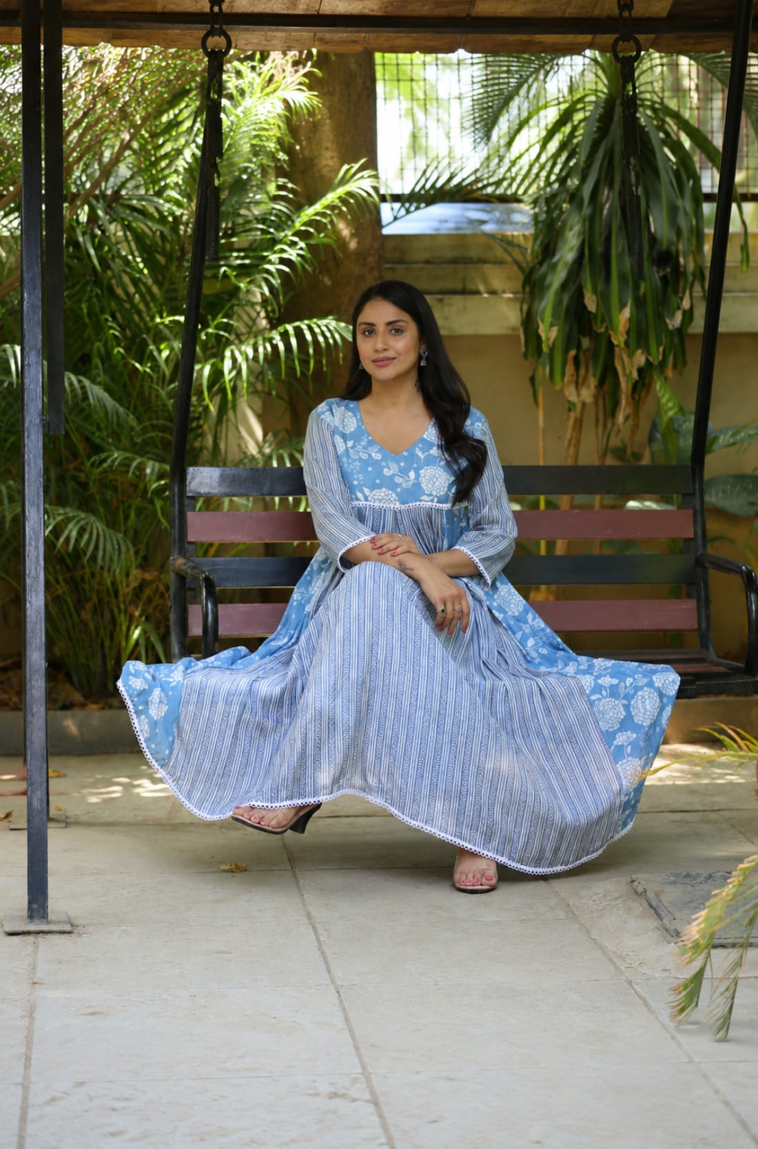 Sky blue white muslin flared kurti with 3/4 sleeves and floral geometric print, front view