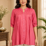 Close-up front view showing front button closure, mandarin collar, and front pleats of the dark peach rayon top.