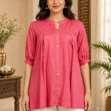 Close-up front view showing front button closure, mandarin collar, and front pleats of the dark peach rayon top.