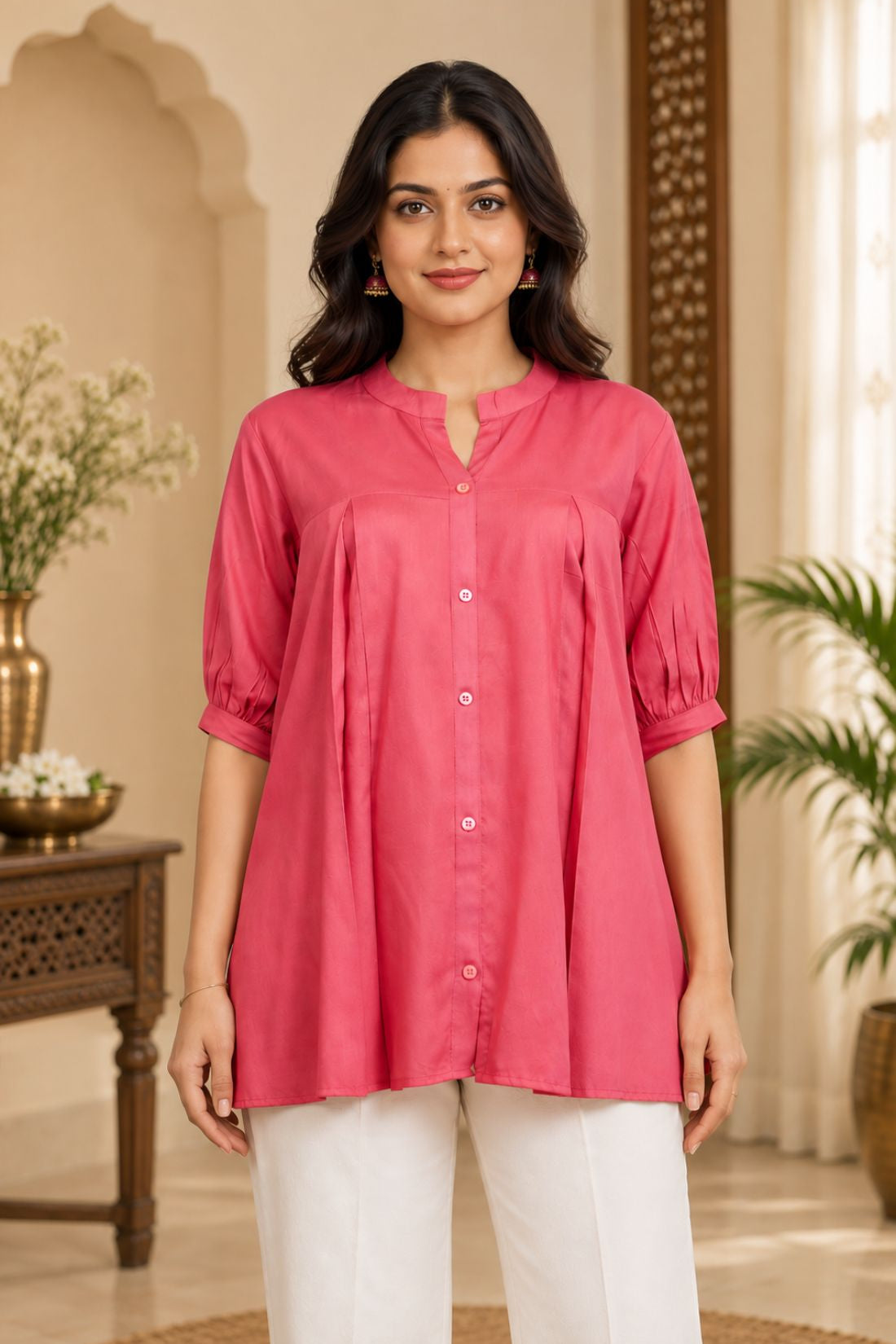 Close-up front view showing front button closure, mandarin collar, and front pleats of the dark peach rayon top.