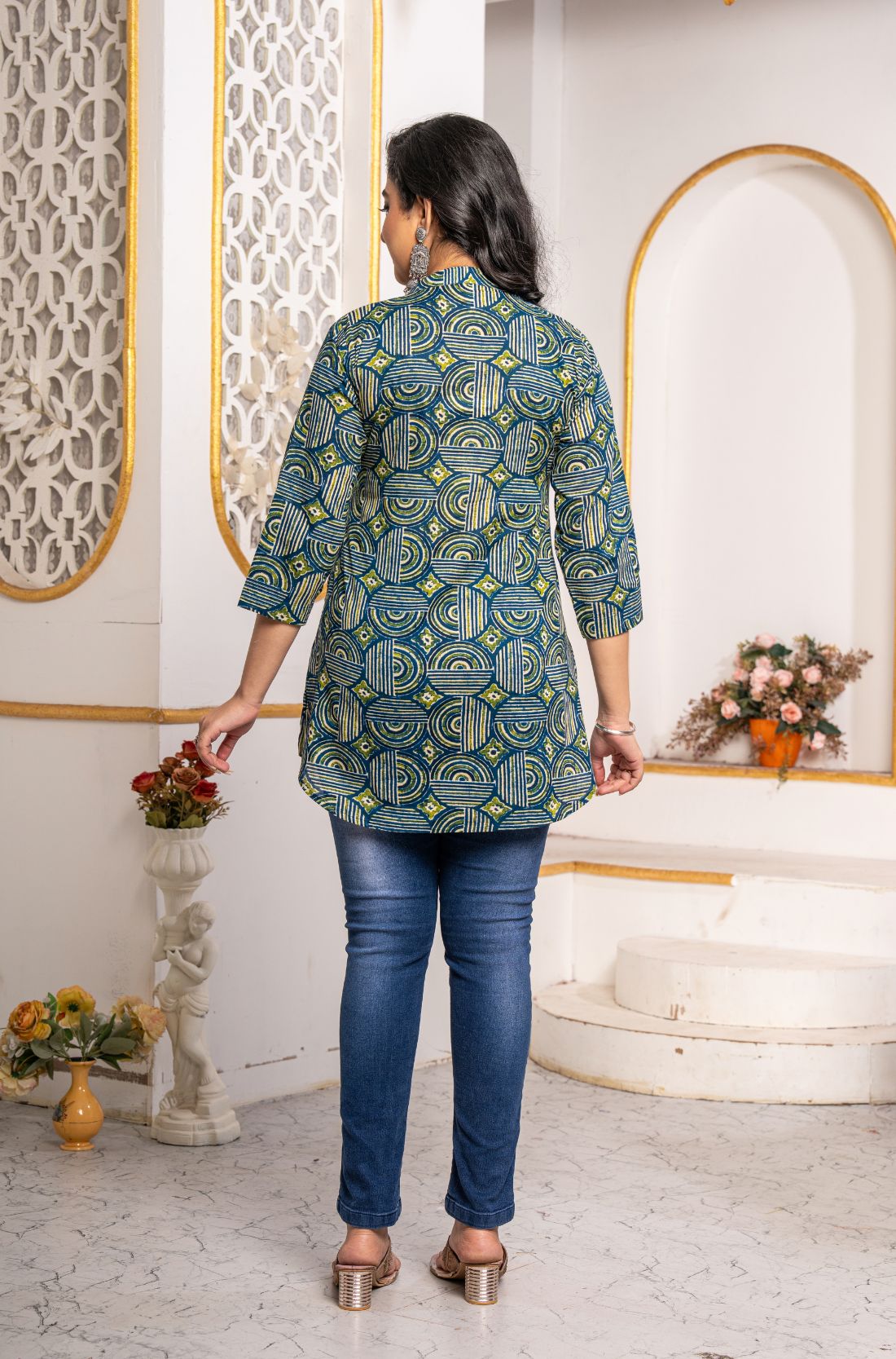 Back view of Women's Geometric Hand Block Print Pure Cotton Shirt Style Kurti in blue and olive green featuring an all-over handcrafted geometric block print and relaxed fit.