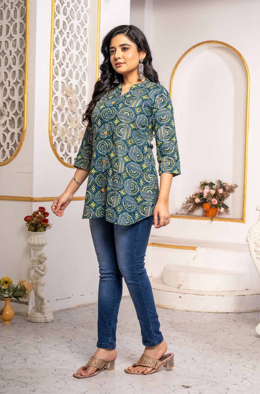 Side profile of Women's Geometric Hand Block Print Pure Cotton Shirt Style Kurti in blue and olive green with a relaxed silhouette and artisan-inspired geometric print.