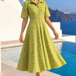 Front view of a woman wearing a light green floral printed pure cotton frock-style kurti with short sleeves.