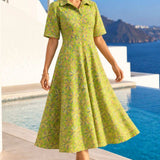 Front view of a woman wearing a light green floral printed pure cotton frock-style kurti with short sleeves.
