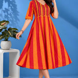 Front angle view showcasing the flared hem and striped pattern of the orange handloom cotton tunic frock for casual and work wear.