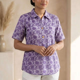 Front view of a women's lavender floral hand block print cotton shirt with relaxed fit and short sleeves.