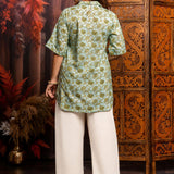 Back View
Back view of a women's mint green block print cotton short kurti featuring short sleeves and curved hem.