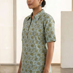 Side view of a women's mint green hand block print cotton shirt with short sleeves, collared neckline, and relaxed fit.
