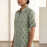 Side view of a women's mint green hand block print cotton shirt with short sleeves, collared neckline, and relaxed fit.